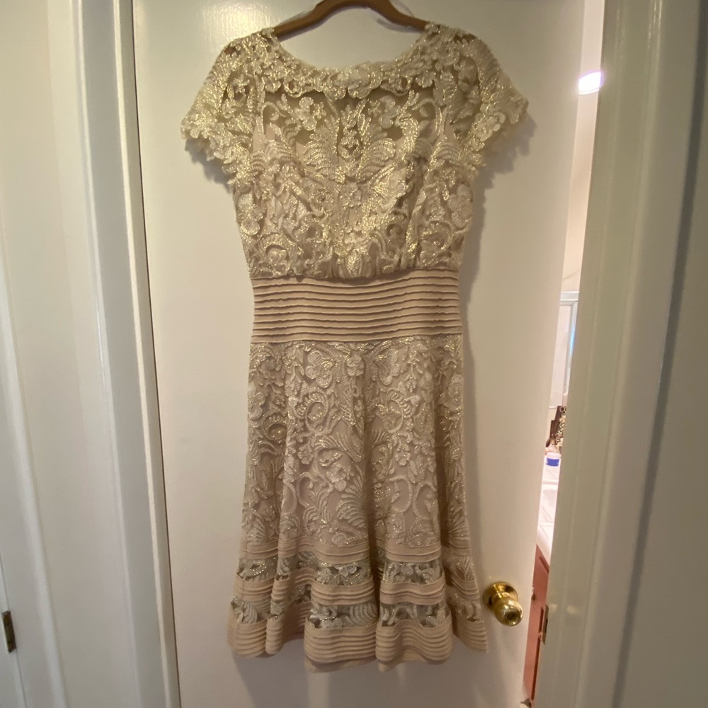Beautiful Tadashi Shoji dress size 4. Never worn, stunning, pristine condition.